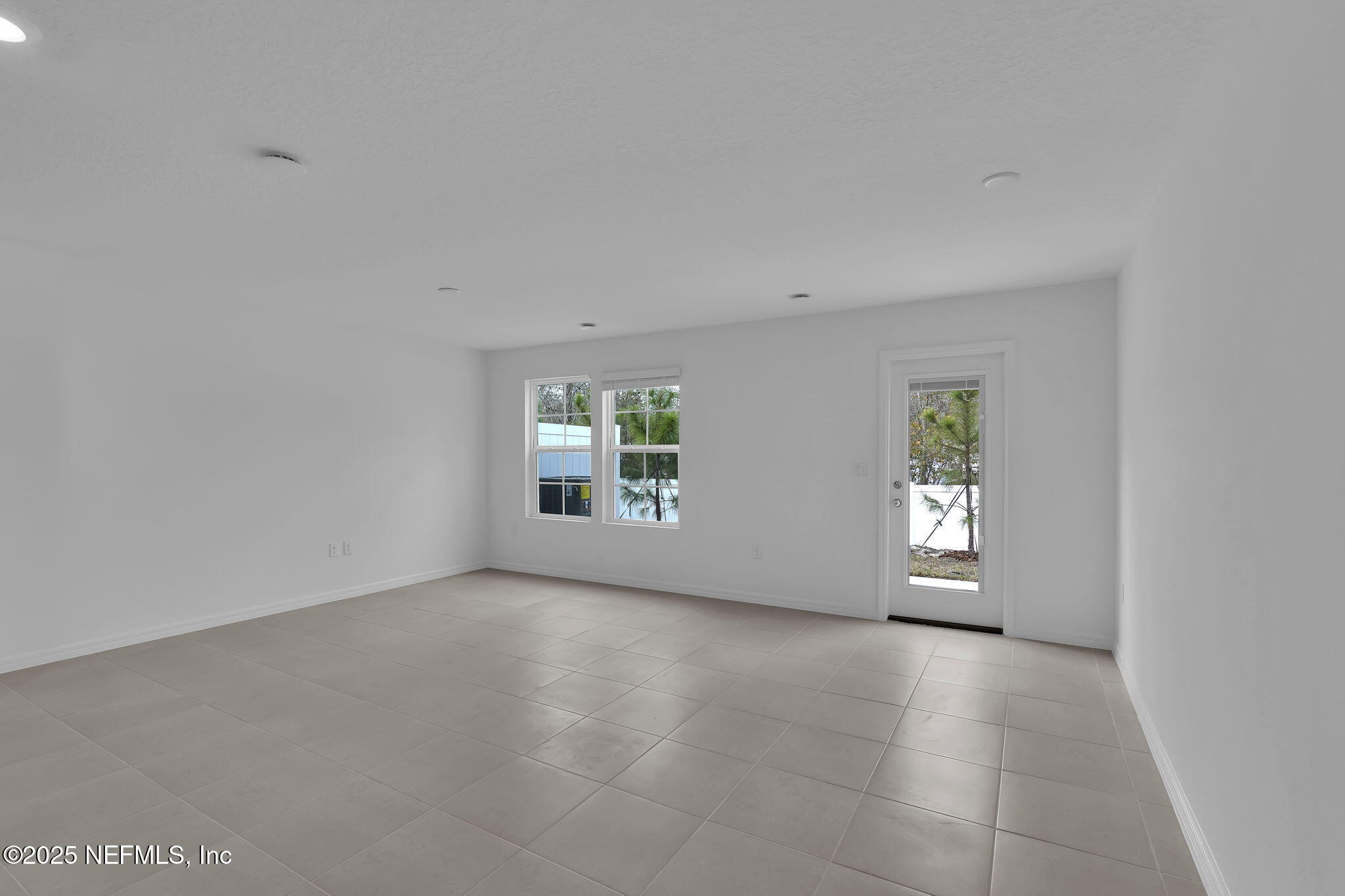 1916 Normandy Pines Lane Jacksonville, FL 32221 - Photo 11 of 21 an empty room with windows