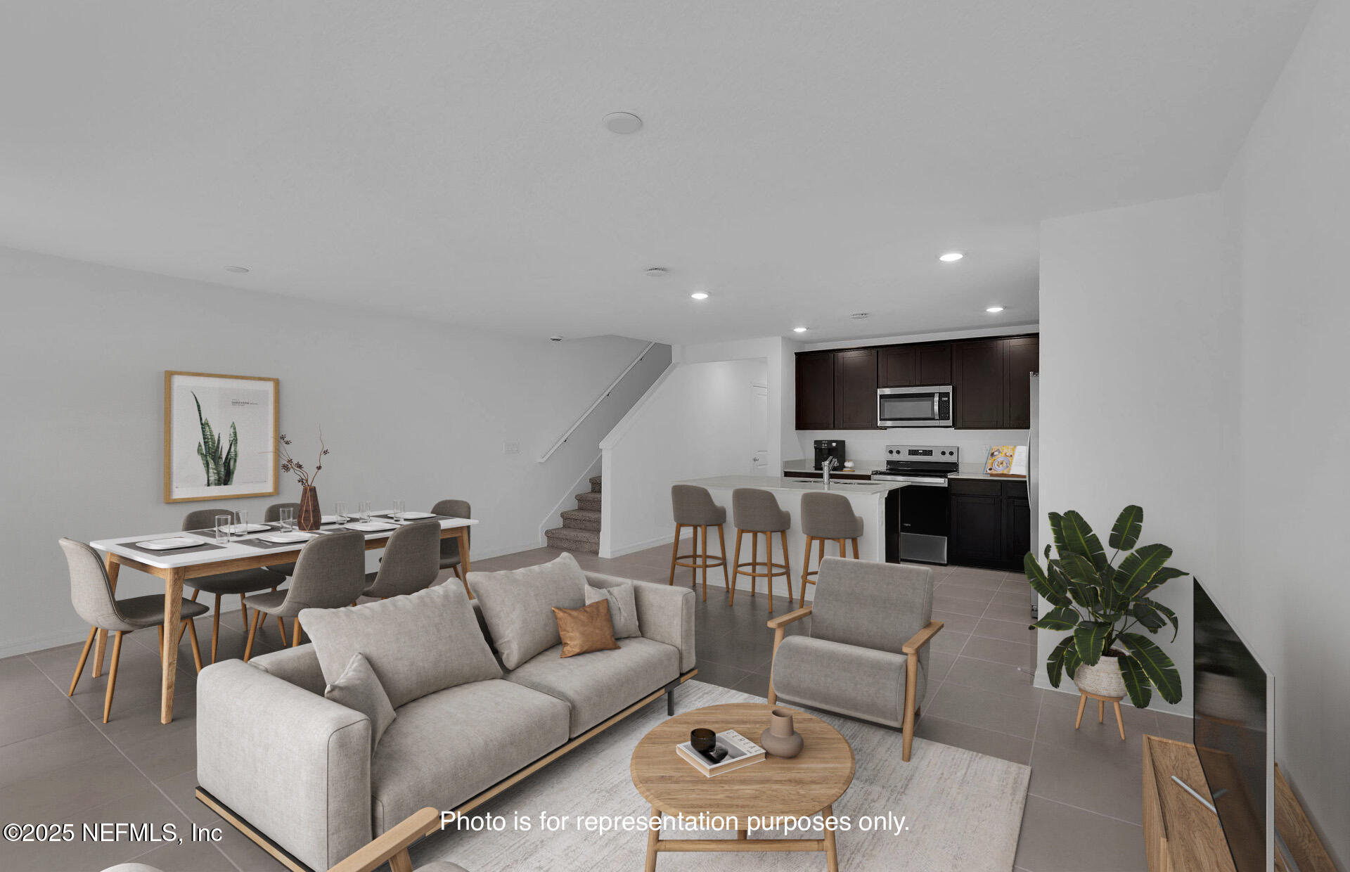1916 Normandy Pines Lane Jacksonville, FL 32221 - Photo 13 of 21 a living room with furniture kitchen view and a potted plant