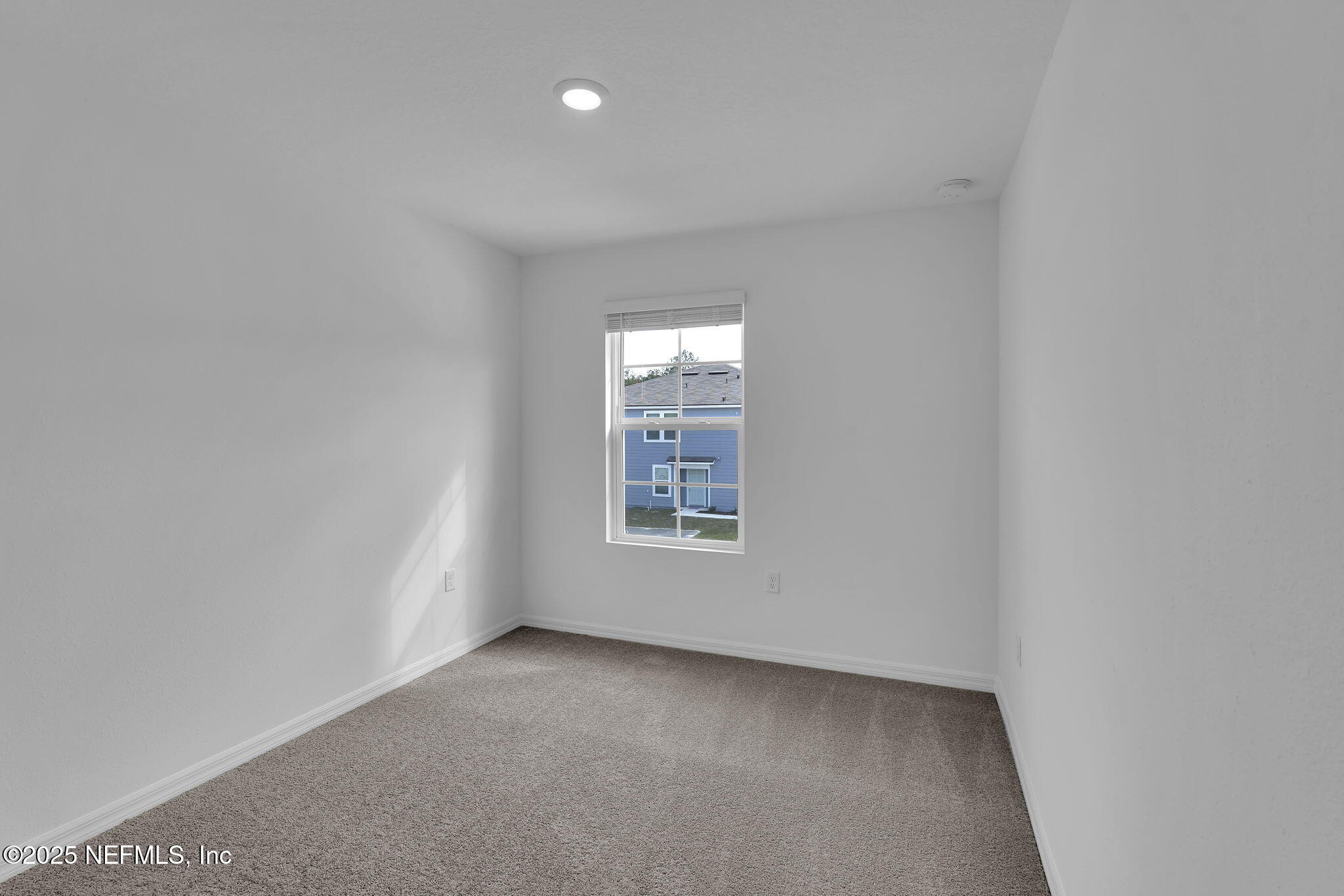 1916 Normandy Pines Lane Jacksonville, FL 32221 - Photo 18 of 21 an empty room with a window