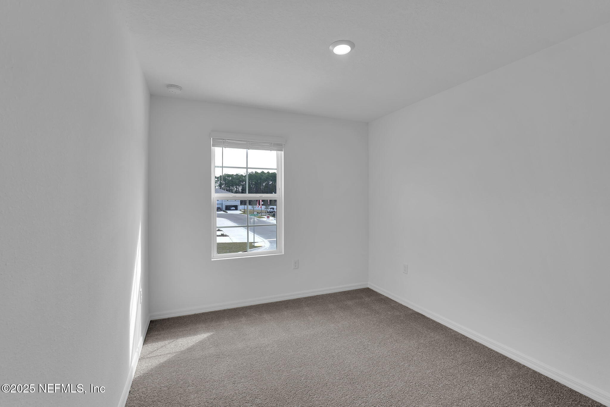1916 Normandy Pines Lane Jacksonville, FL 32221 - Photo 19 of 21 an empty room with a window