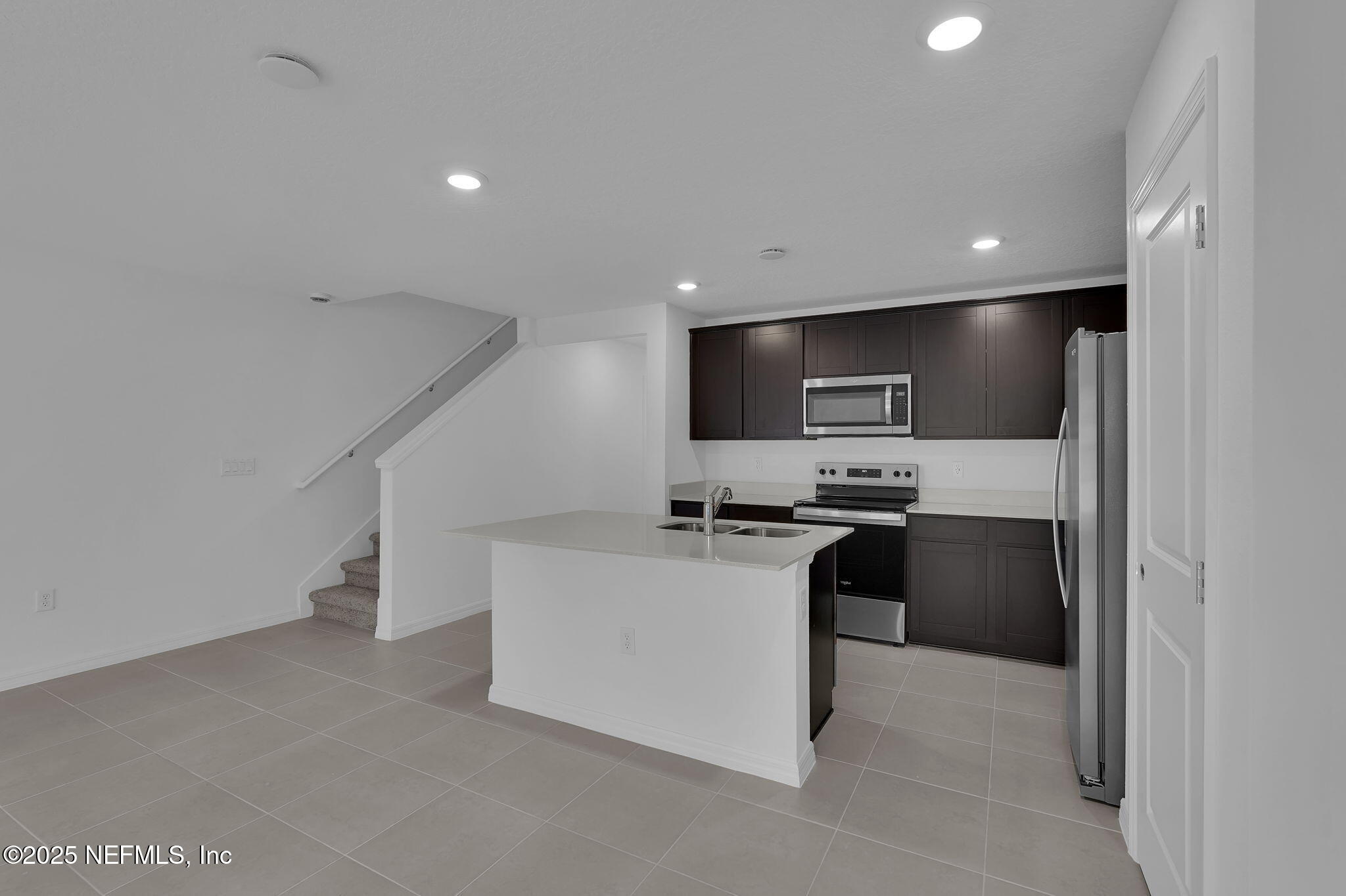 1916 Normandy Pines Lane Jacksonville, FL 32221 - Photo 7 of 21 a kitchen with stainless steel appliances a refrigerator sink and stove