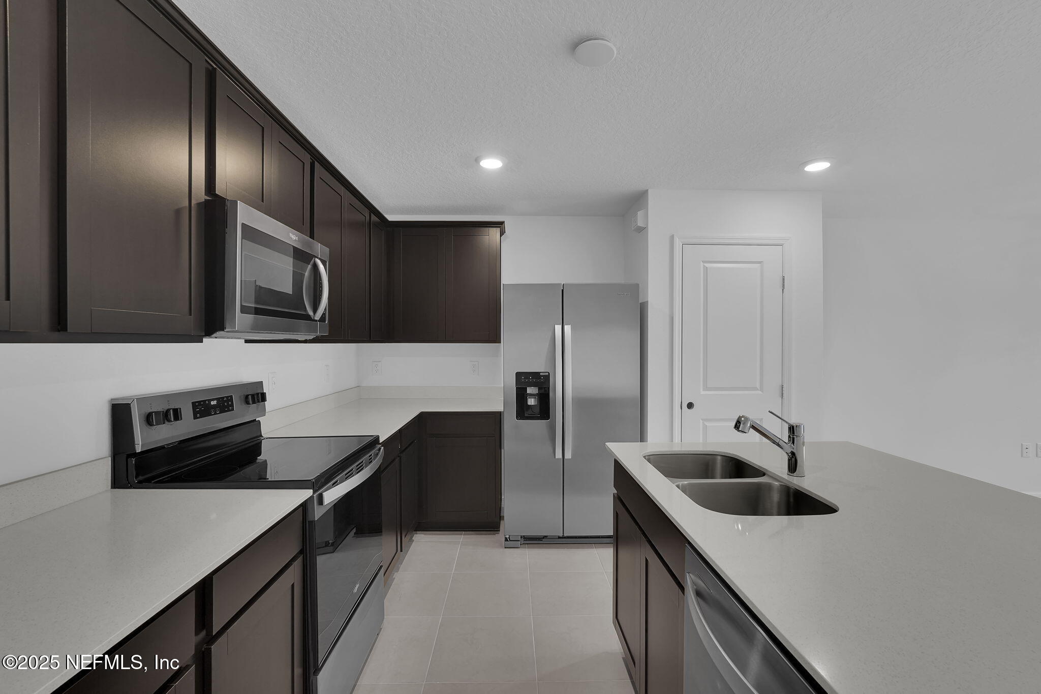 1916 Normandy Pines Lane Jacksonville, FL 32221 - Photo 8 of 21 a kitchen with stainless steel appliances a sink a stove and a refrigerator