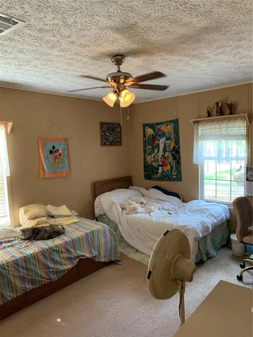 a kitchen with stainless steel appliances kitchen island granite countertop a refrigerator and a sink