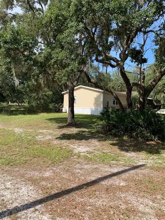a view of a pool with a yard