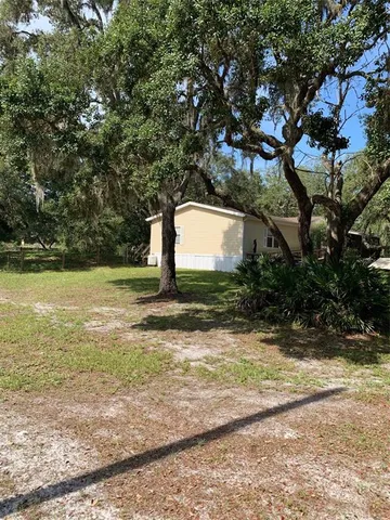 a view of a pool with a yard