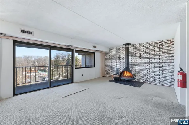 a view of car parked in front of house