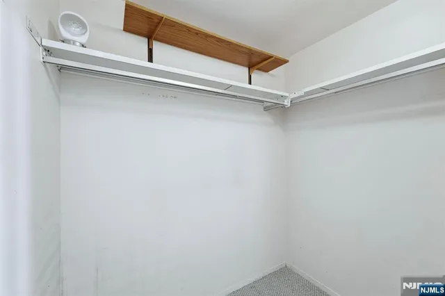 a view of an empty walk in closet