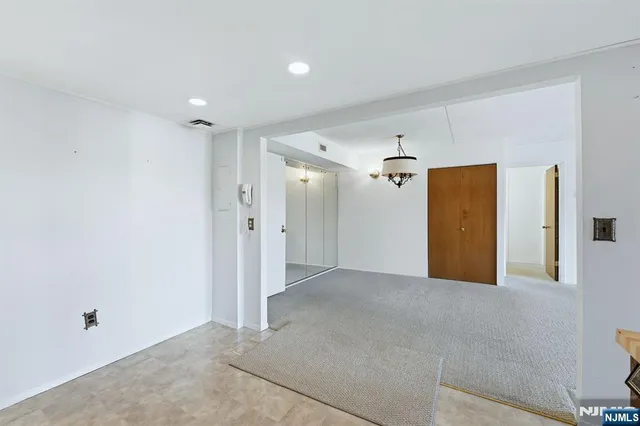 a view of a hallway with an entryway