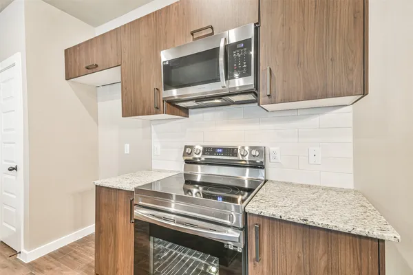 a kitchen with a stove and a microwave