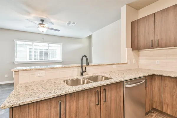 a kitchen with a sink and cabinets