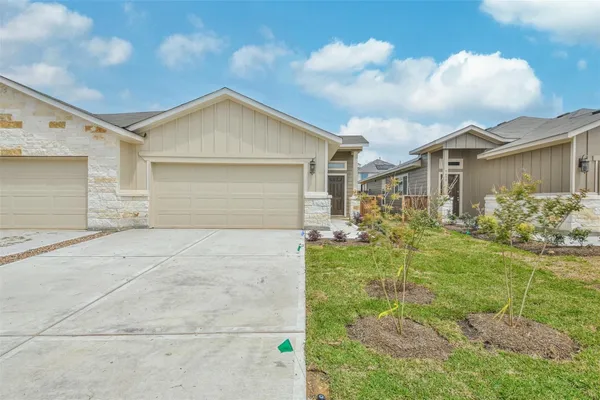 a view of a yard in front of a house