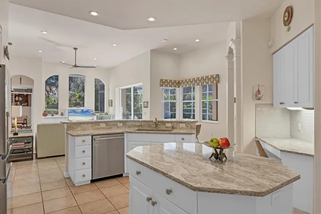 a bedroom with a bed and a large mirror