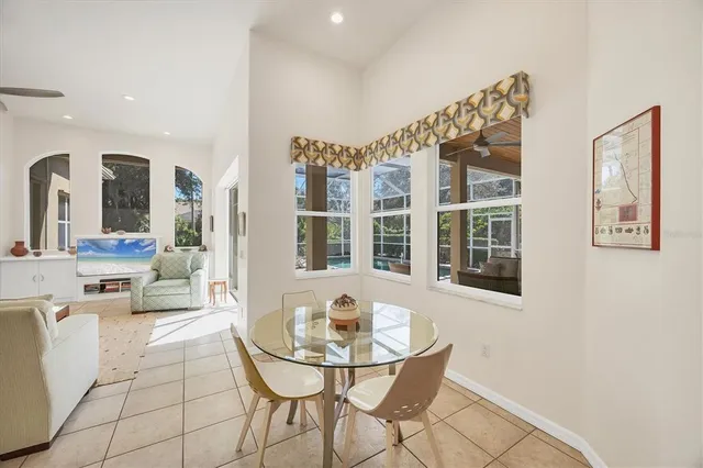 a bedroom with a bed couch and a window