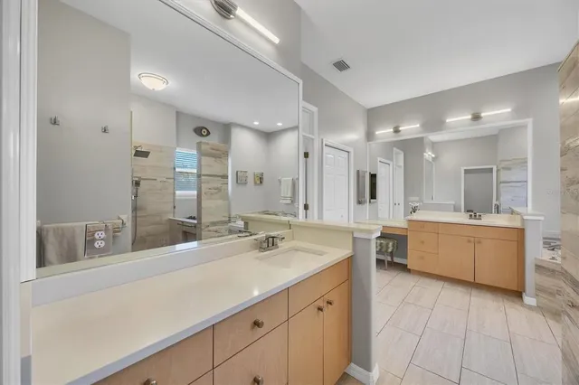 a view of a lake with houses in the back