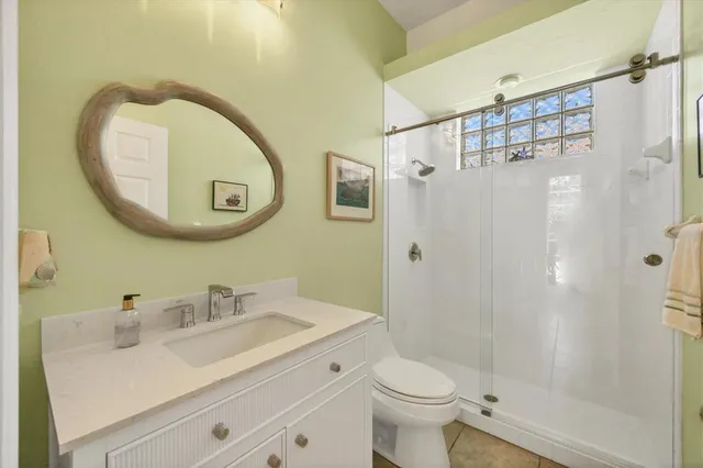 a view of a patio with couches and table and chairs and potted plants