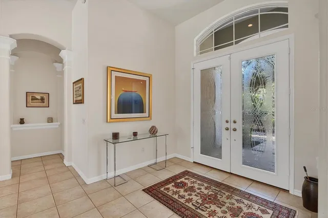 a kitchen with granite countertop white cabinets a sink and appliances