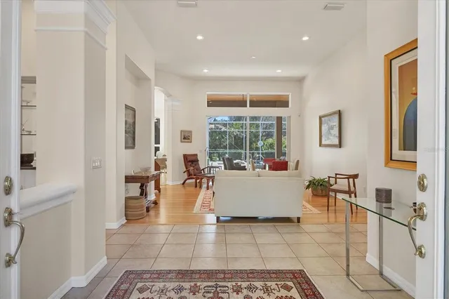 a kitchen with stainless steel appliances granite countertop a sink and a white cabinets
