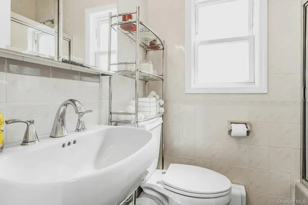 a bathroom with a sink a toilet and a bathtub
