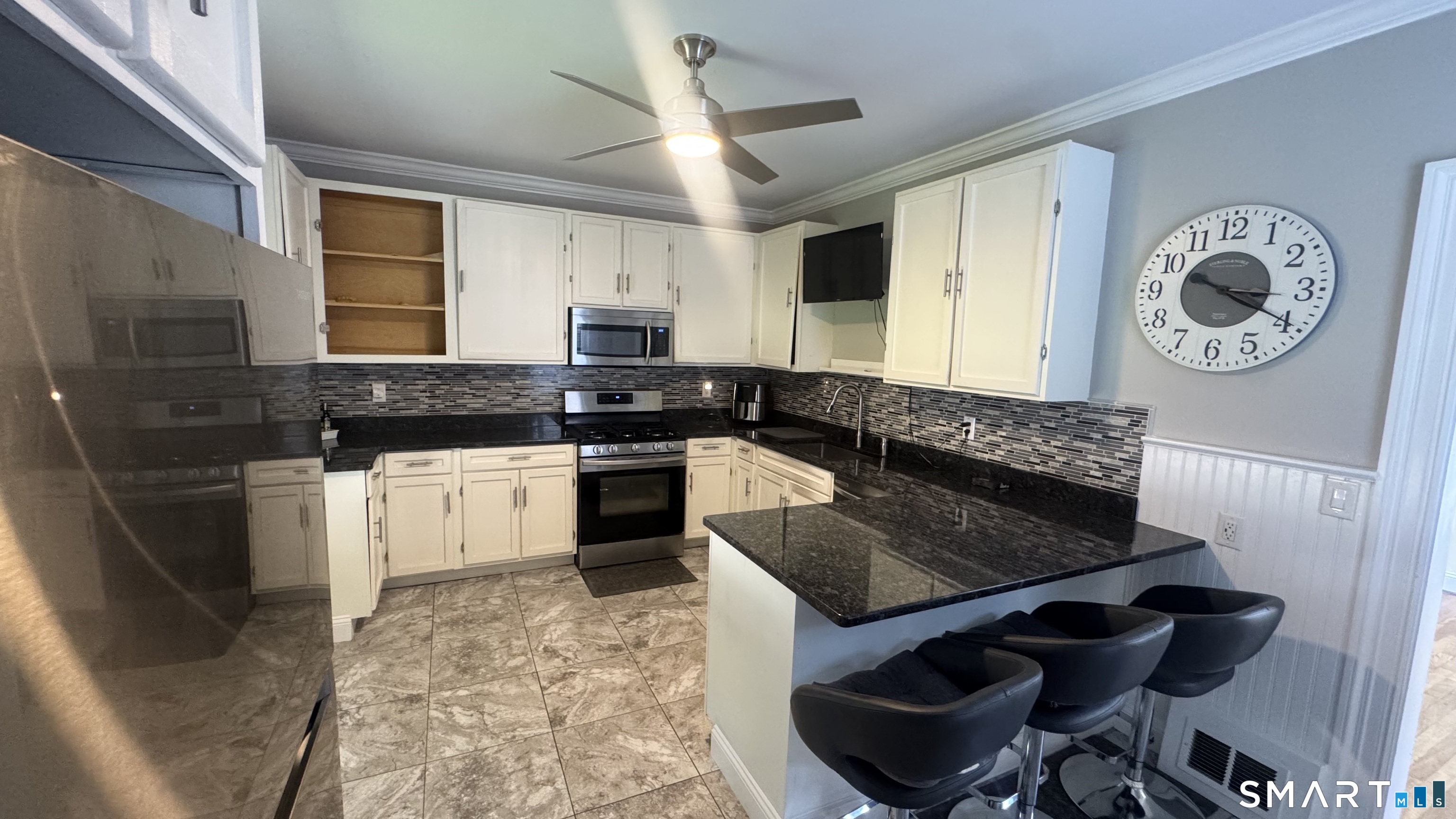 104 Prospect Street Ansonia, CT 06401 - Photo 14 of 40 a kitchen with a stove and a refrigerator