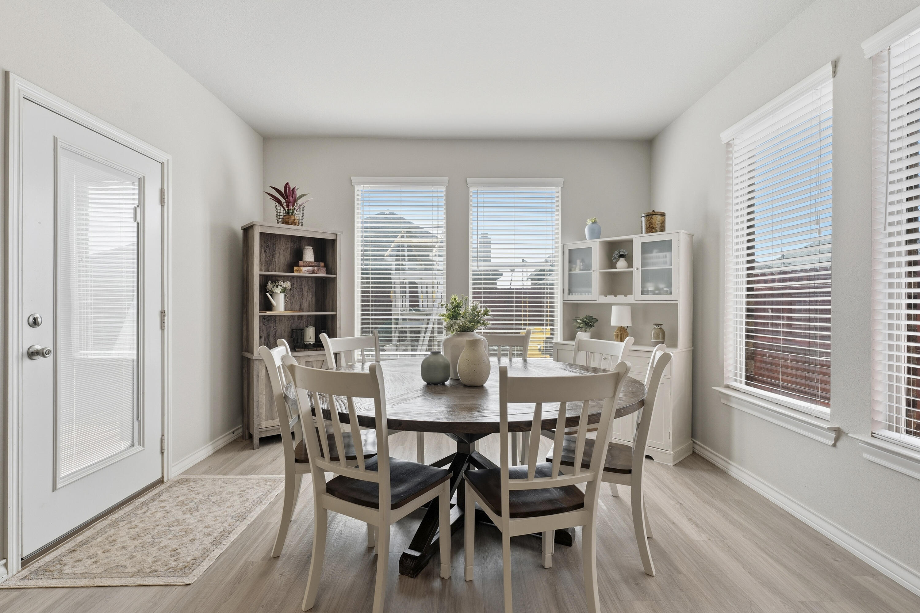 819 North 3rd Street Wolfforth, TX 79382 - Photo 12 of 31 a view of a dining room with furniture and wooden floor