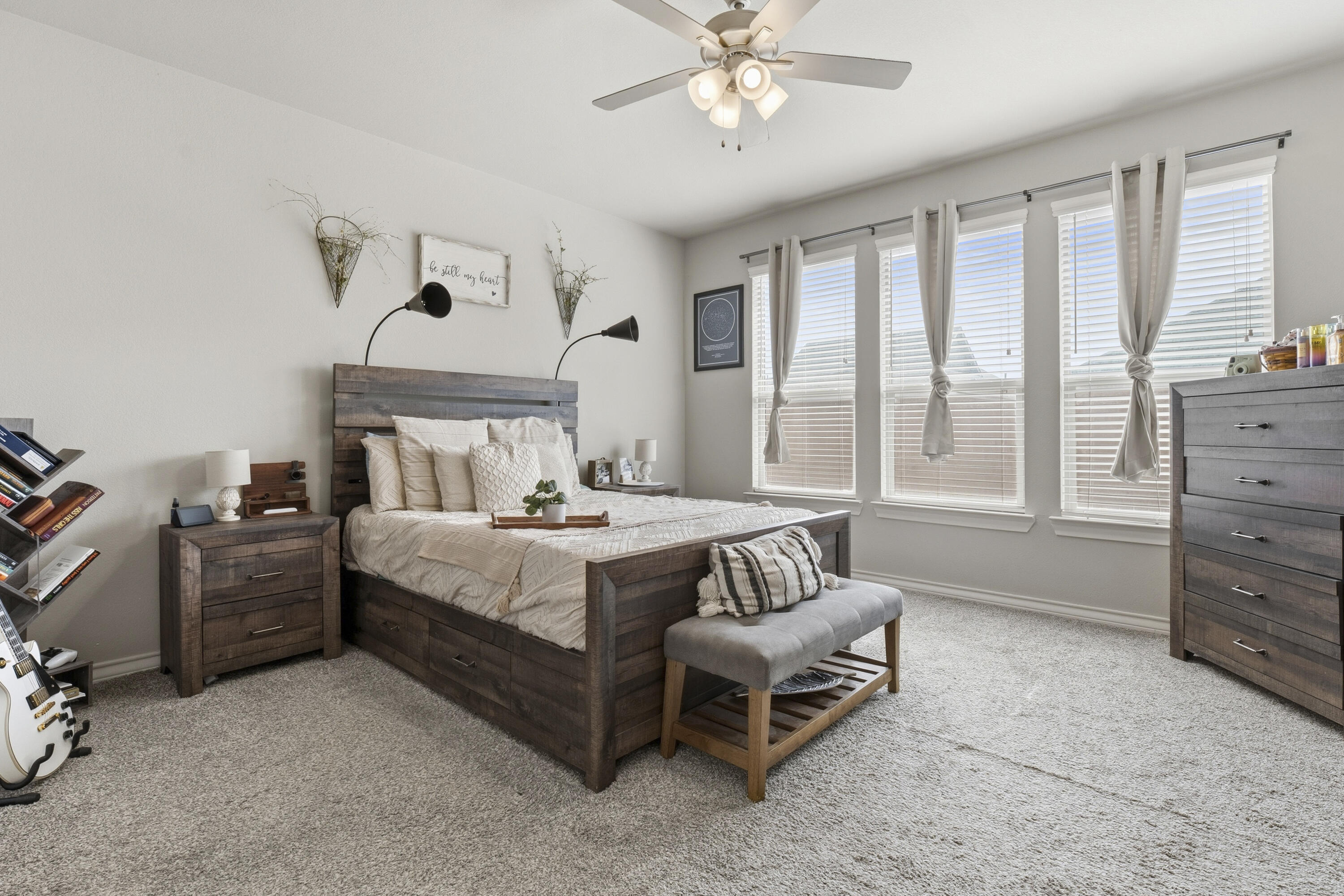 819 North 3rd Street Wolfforth, TX 79382 - Photo 13 of 31 a bedroom with a bed and a chandelier