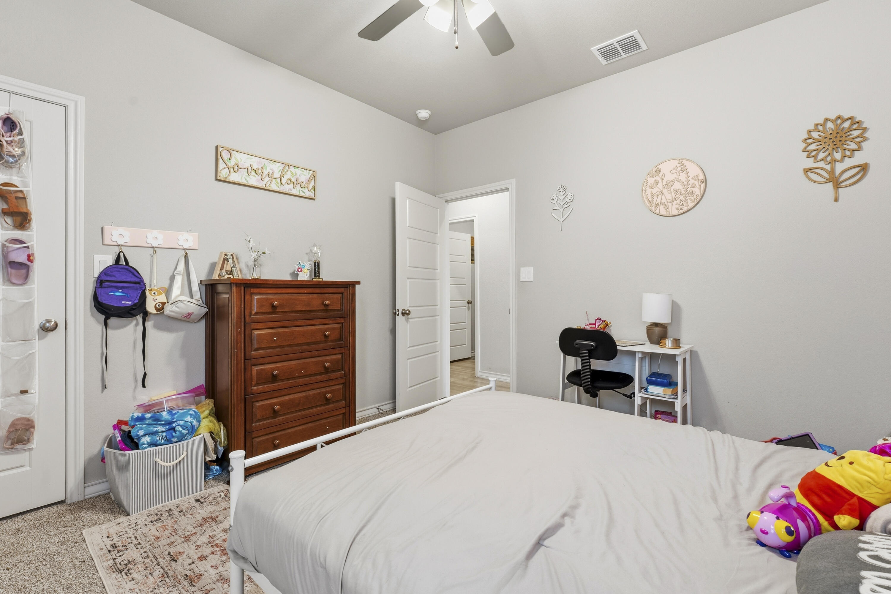 819 North 3rd Street Wolfforth, TX 79382 - Photo 19 of 31 a bedroom with a bed and dresser
