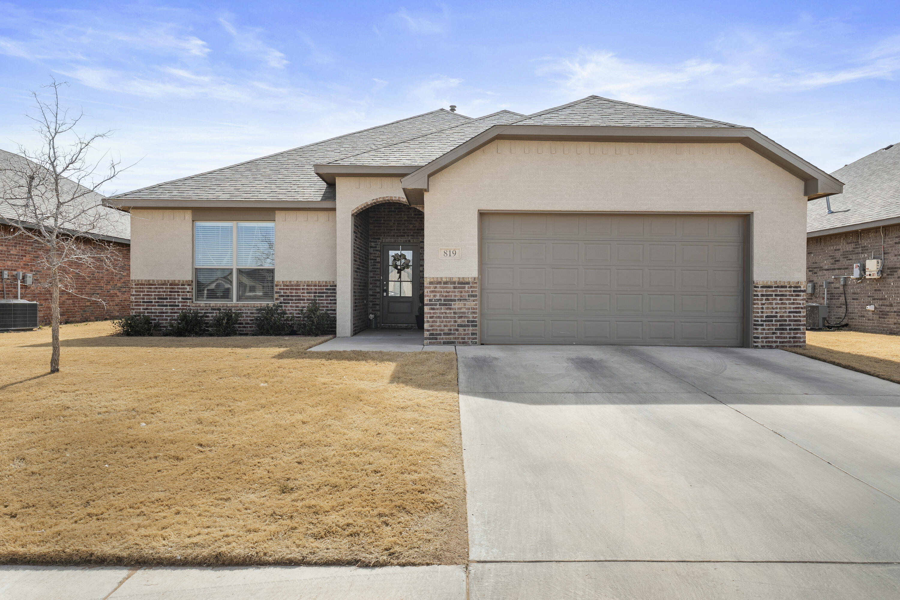819 North 3rd Street Wolfforth, TX 79382 - Photo 2 of 31 a front view of a house with a yard