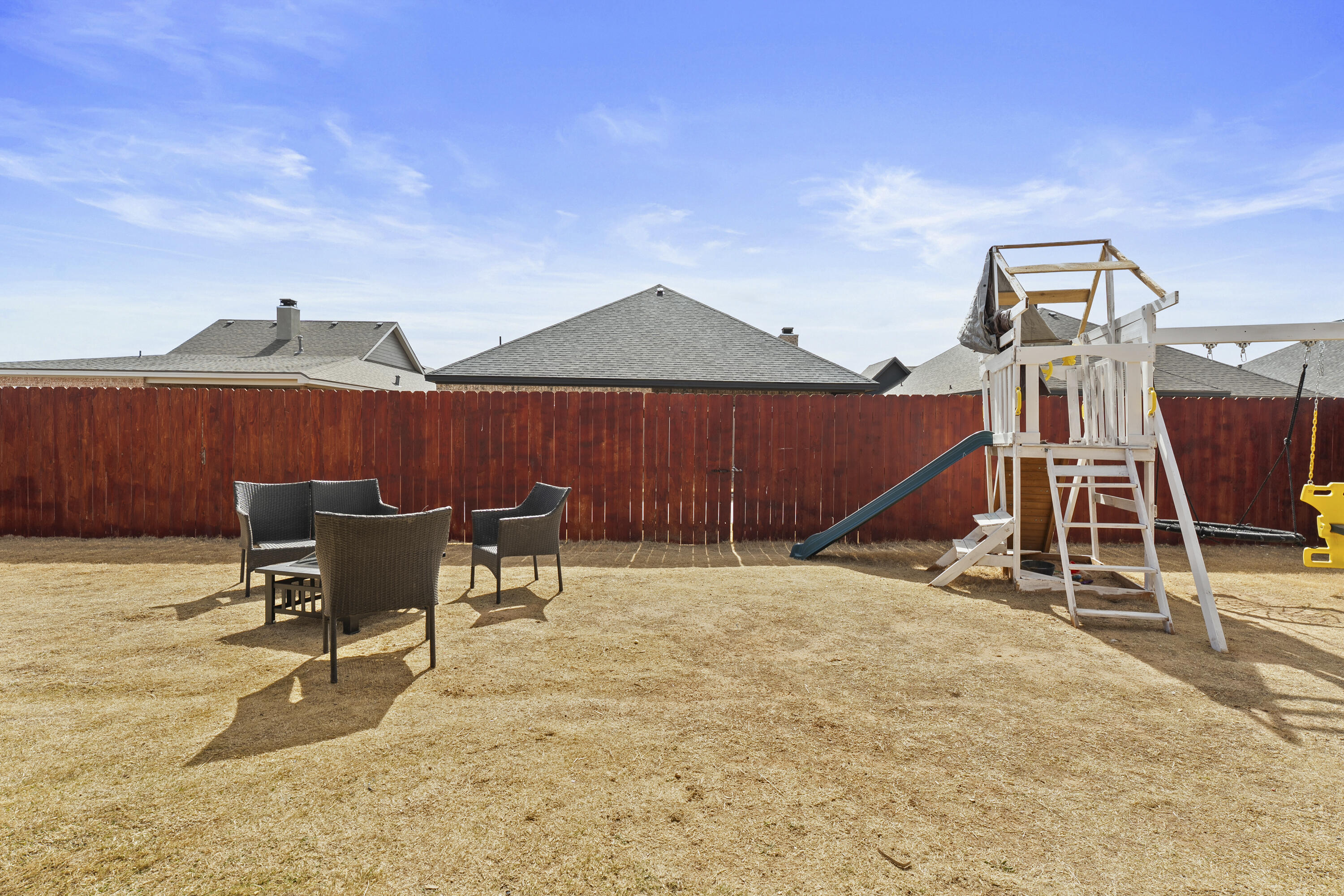 819 North 3rd Street Wolfforth, TX 79382 - Photo 26 of 31 a view of a patio with a table and chairs