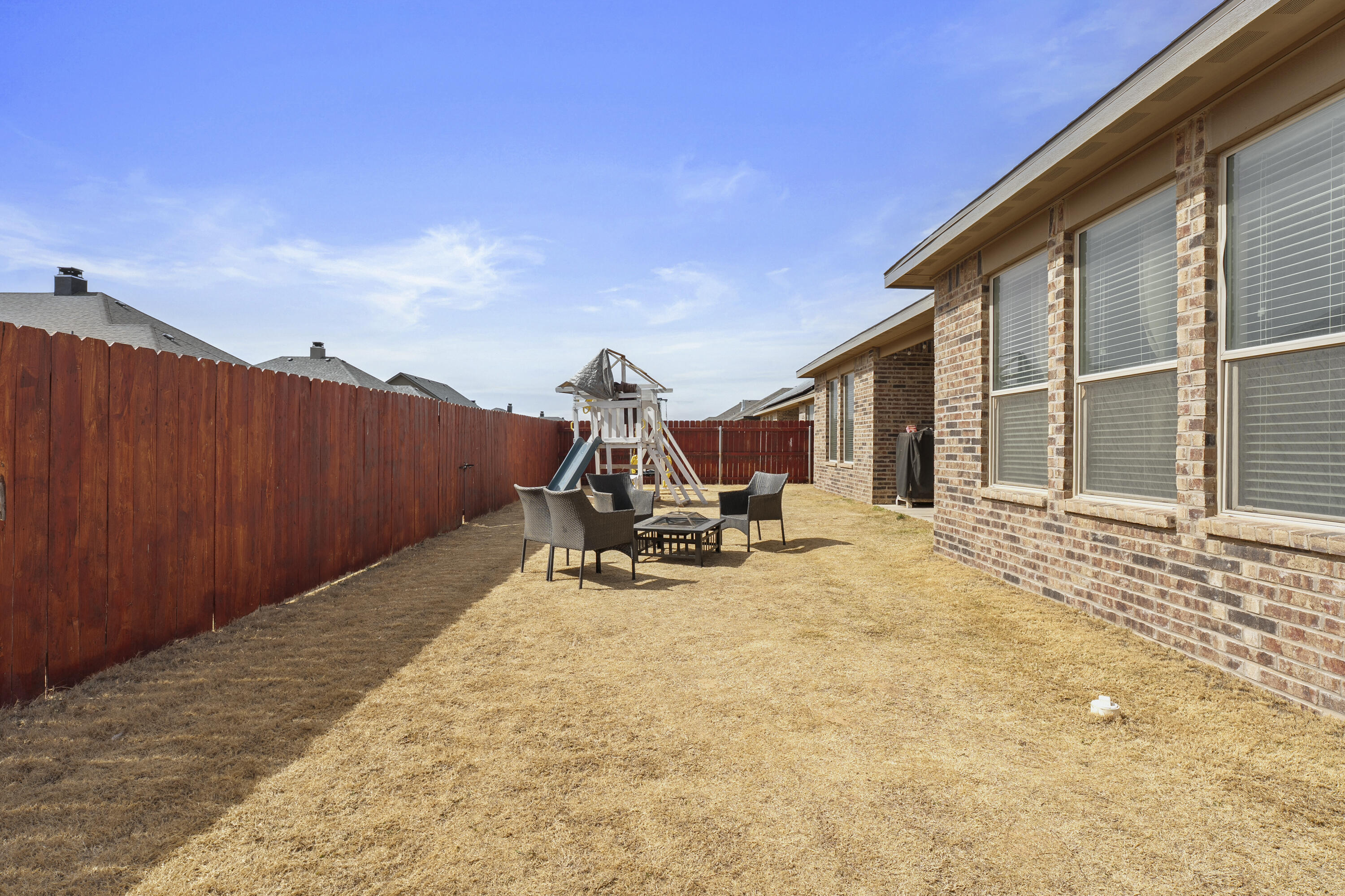 819 North 3rd Street Wolfforth, TX 79382 - Photo 30 of 31 a view of a backyard with table and chairs