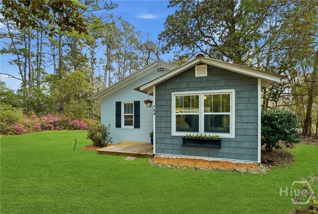 704 Lexington Avenue Rincon, GA 31326 - Photo 2 of 33 Grass has been enhanced.