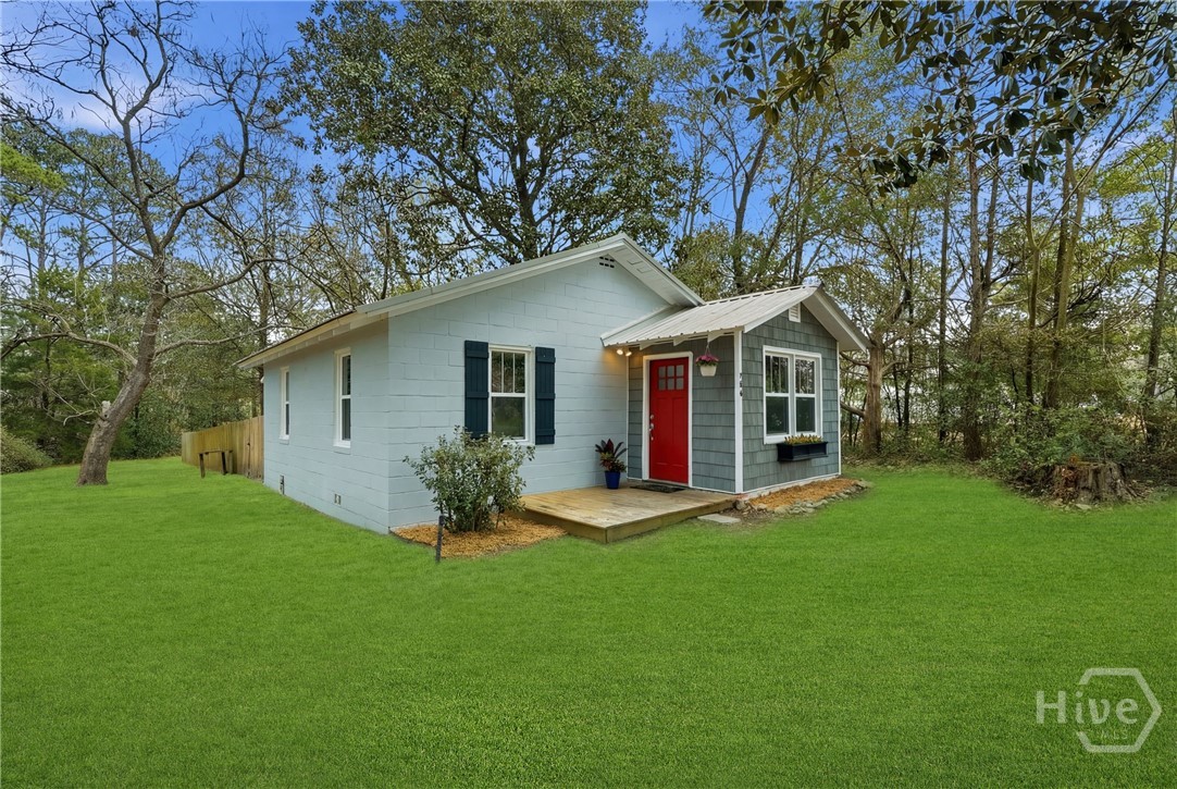 704 Lexington Avenue Rincon, GA 31326 - Photo 3 of 33 Grass has been enhanced. Tree closest to fence is being removed soon.