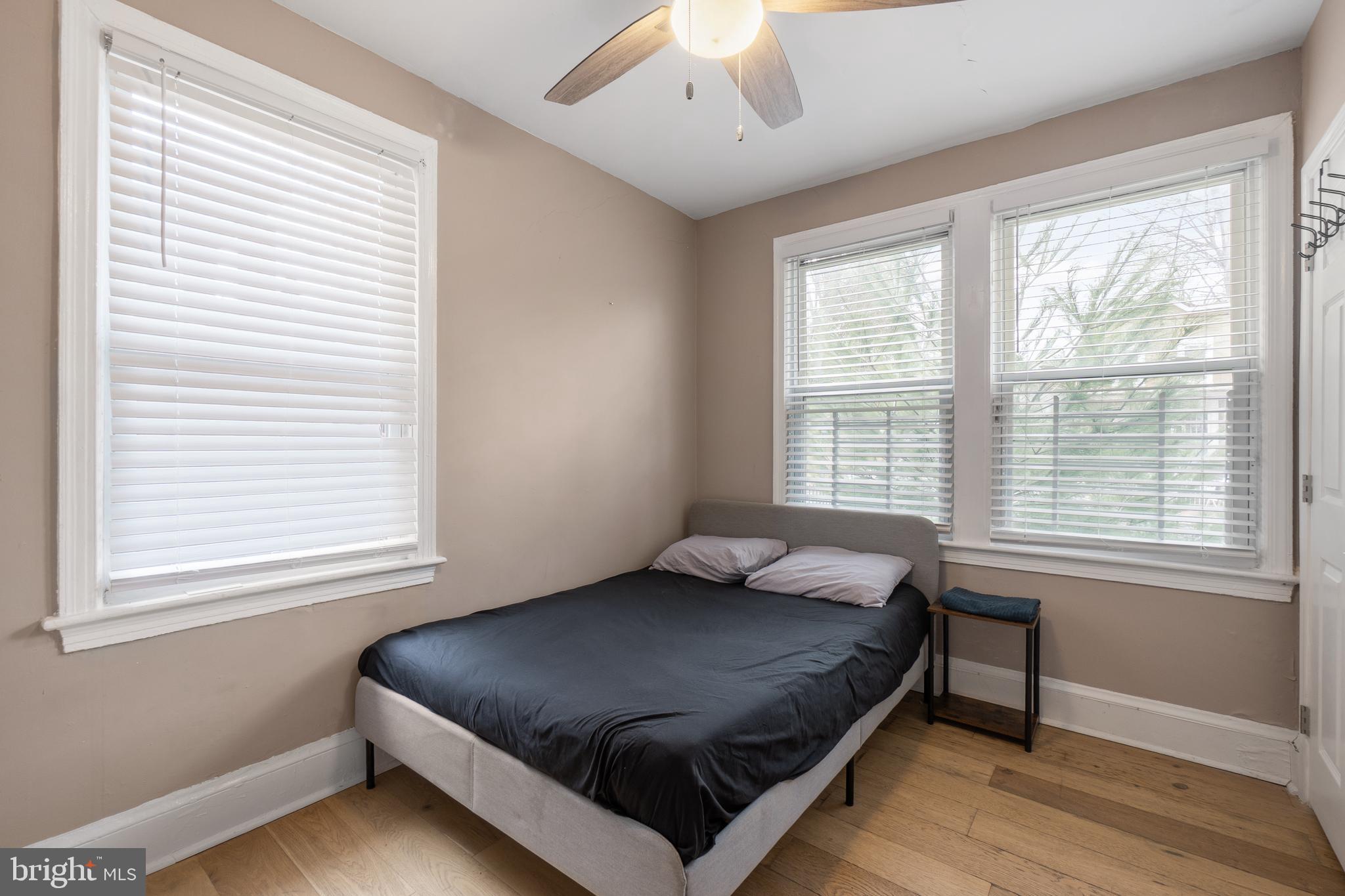 1526 V Street Southeast, Unit 2 Washington, DC 20020 - Photo 13 of 24 a bed sitting in a bedroom next to a window