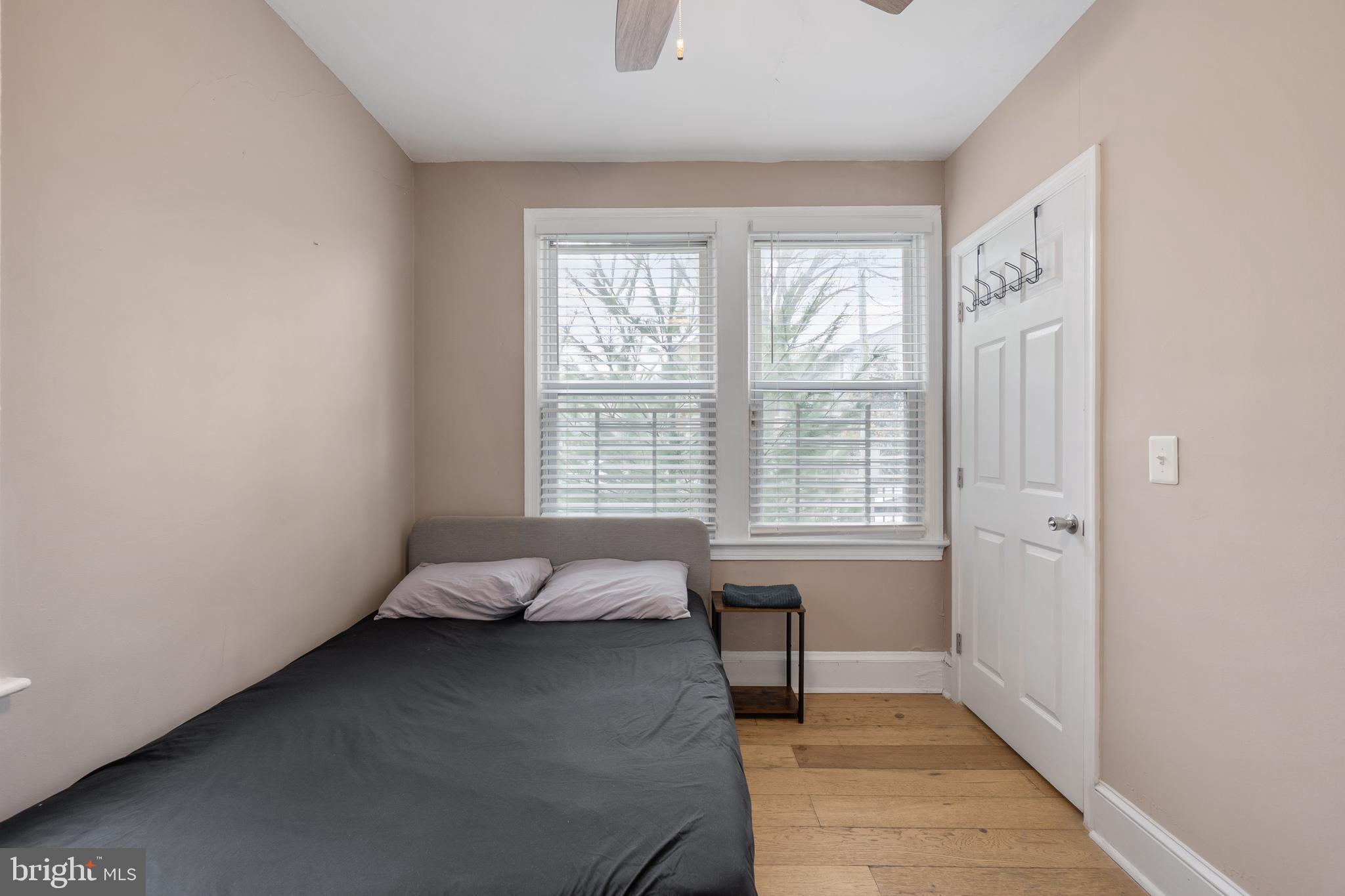 1526 V Street Southeast, Unit 2 Washington, DC 20020 - Photo 14 of 24 a spacious bedroom with a bed and a window