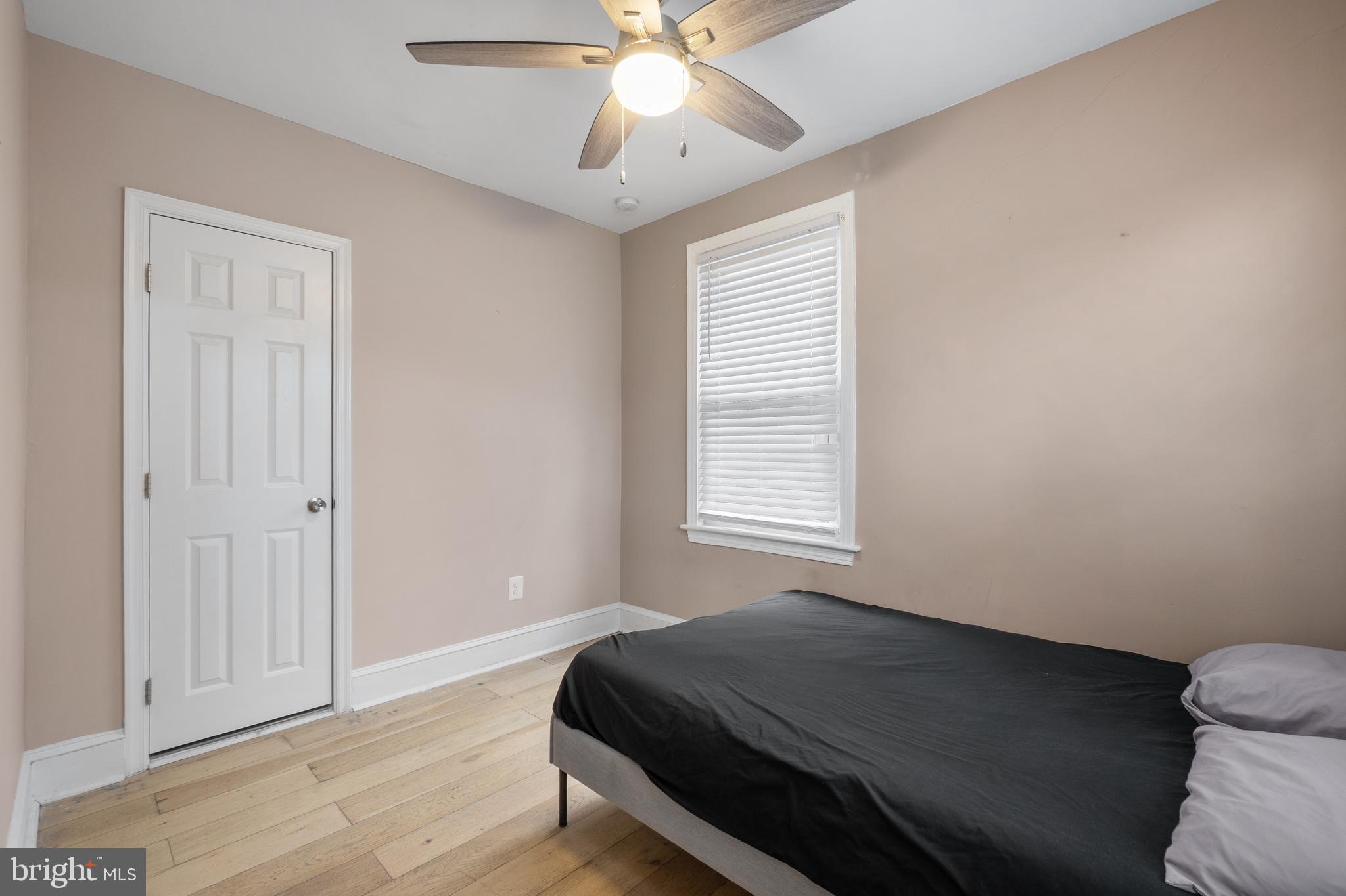 1526 V Street Southeast, Unit 2 Washington, DC 20020 - Photo 15 of 24 a bed room with a bed and a window