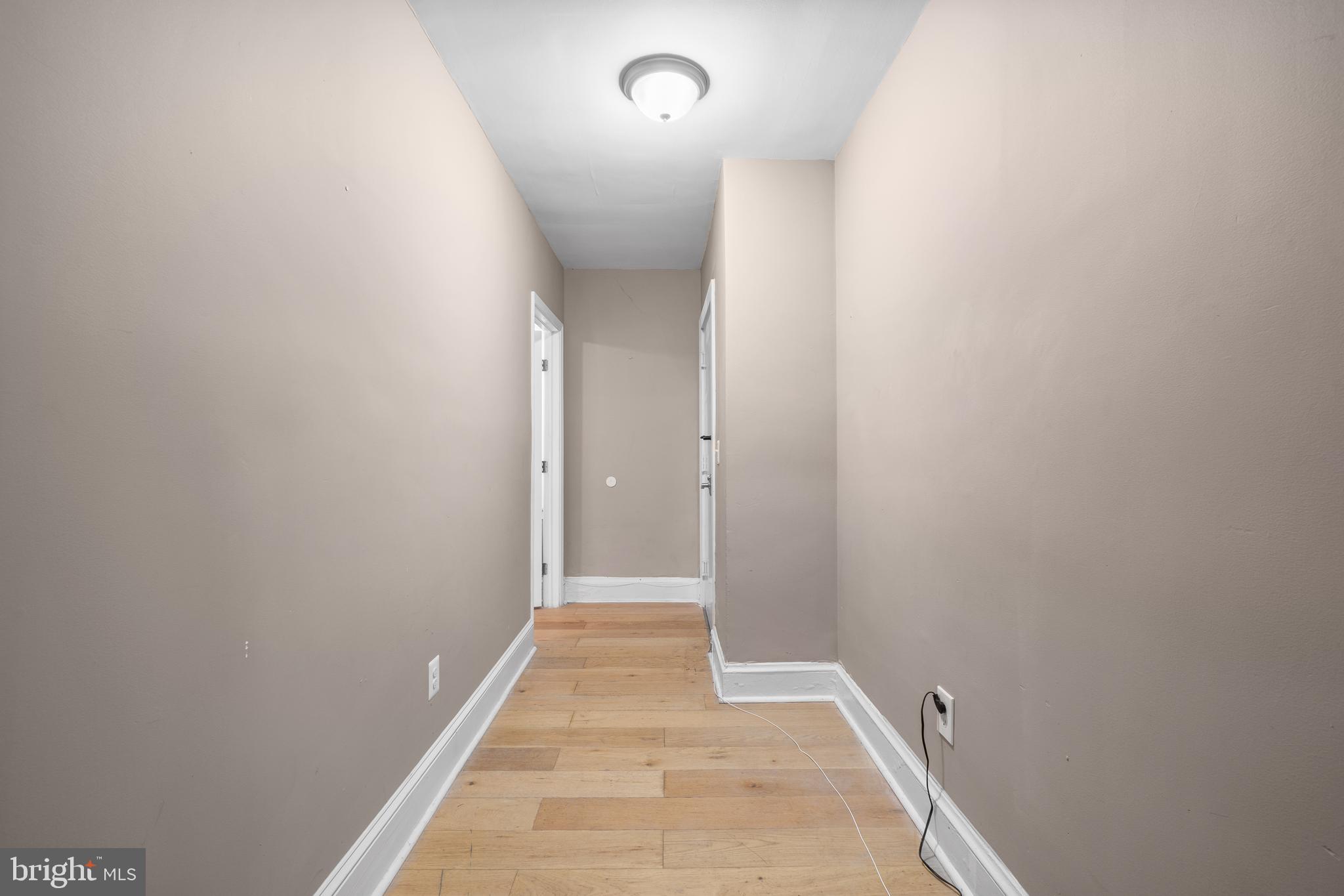 1526 V Street Southeast, Unit 2 Washington, DC 20020 - Photo 19 of 24 a view of a hallway with wooden floor