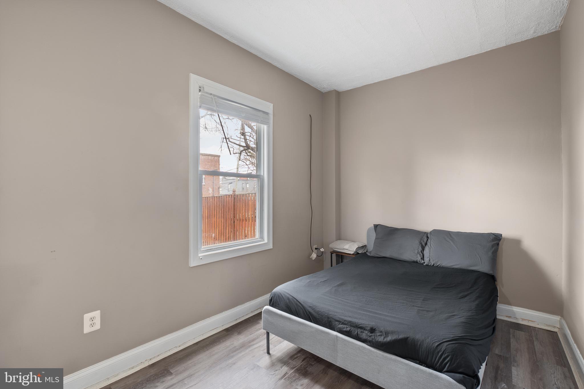 1526 V Street Southeast, Unit 2 Washington, DC 20020 - Photo 9 of 24 a living room with a couch and a window