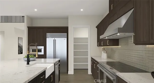 a kitchen with a sink and a refrigerator