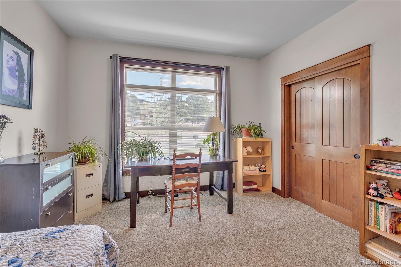 6839 Estes Drive Arvada, CO 80004 - Photo 16 of 34 a workspace with furniture and a window