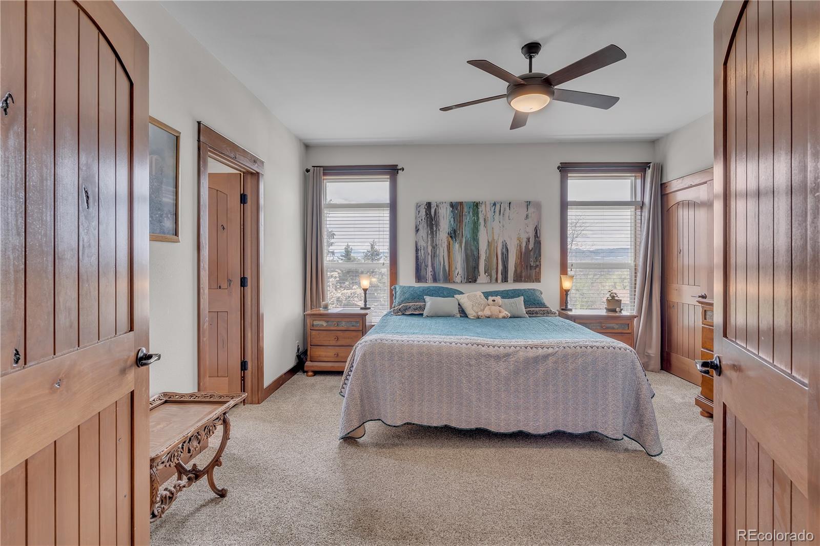 6839 Estes Drive Arvada, CO 80004 - Photo 19 of 34 a bedroom with a bed and window