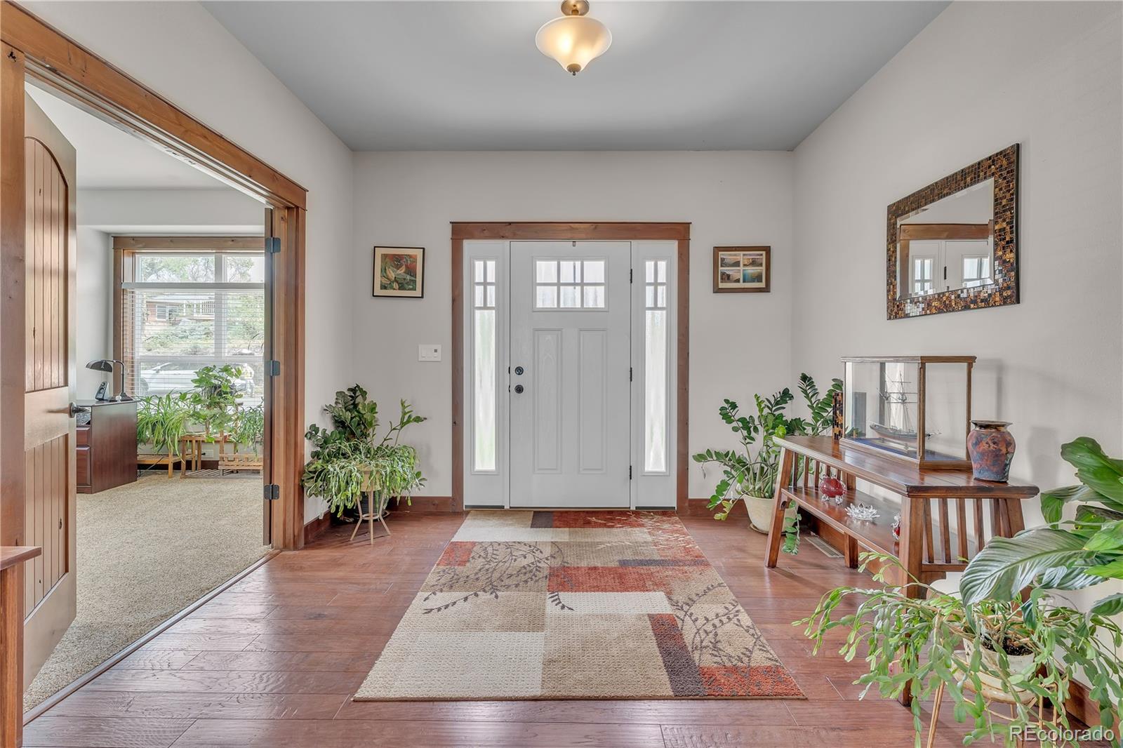6839 Estes Drive Arvada, CO 80004 - Photo 3 of 34 a living room with furniture