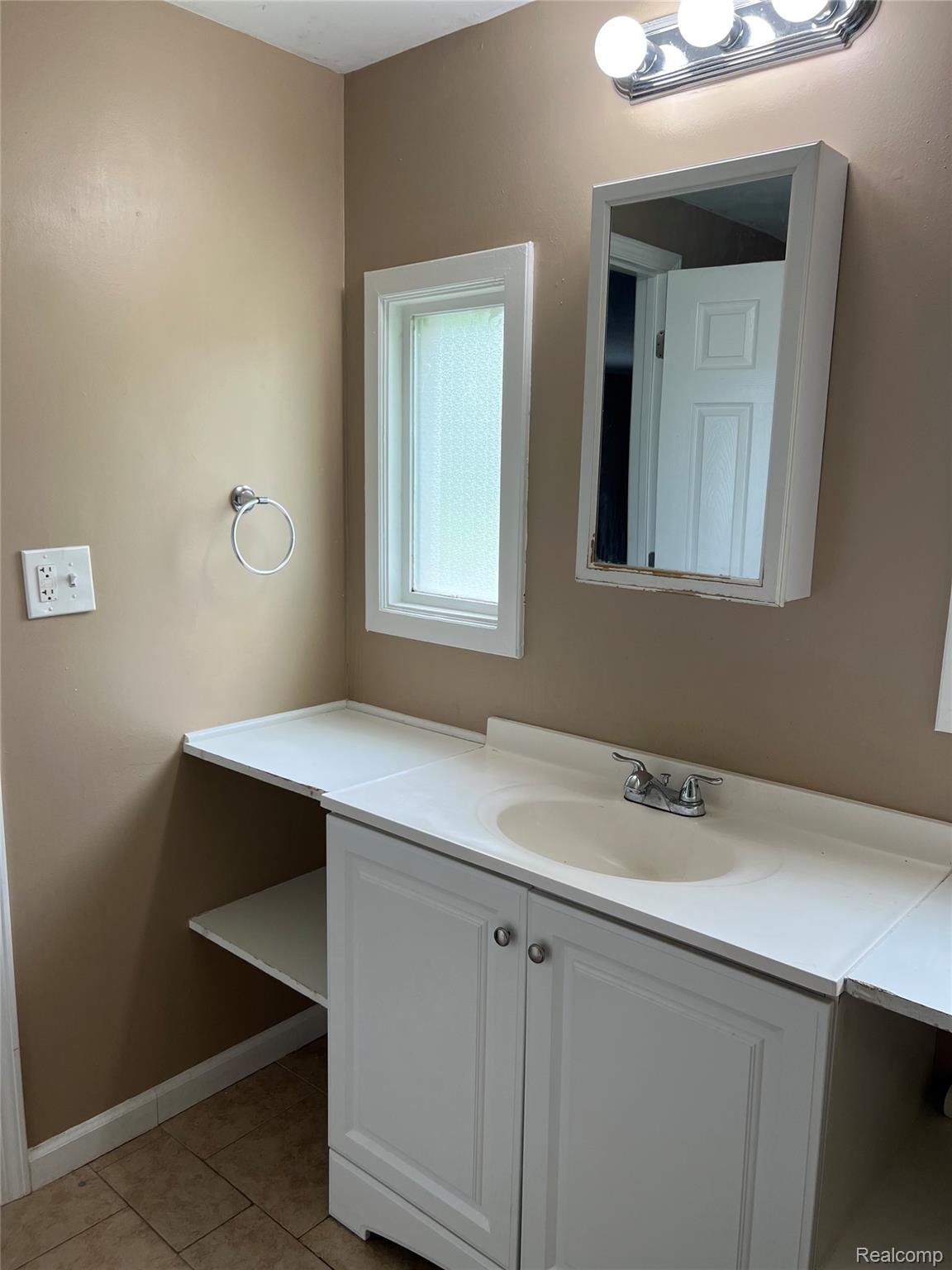 35945 Herman Street Romulus, MI 48174 - Photo 11 of 26 Bathroom featuring vanity and light tile patterned floors