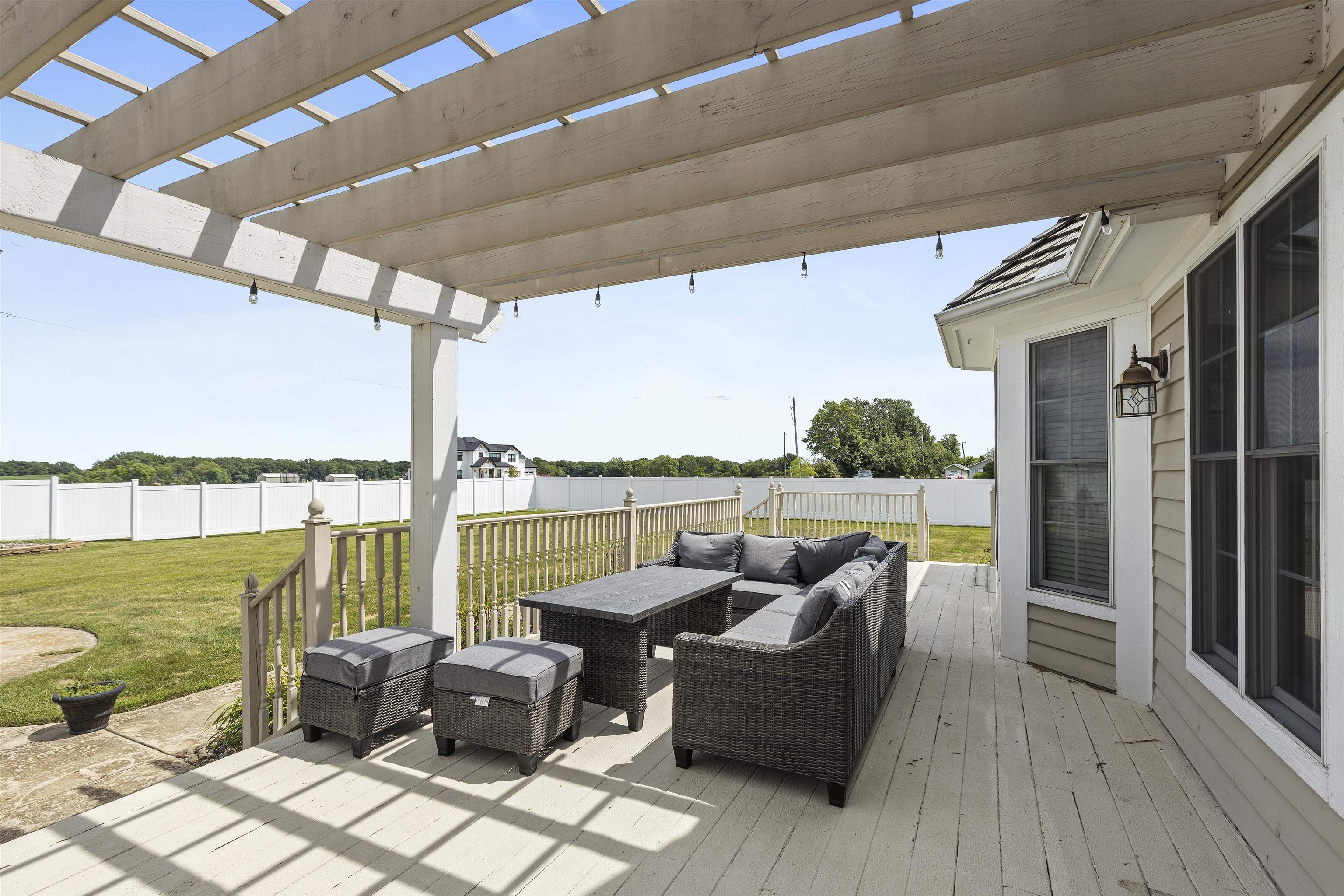 1130 Eagle Chase Drive Seneca, IL 61360 - Photo 11 of 46 a balcony with furniture and a floor to ceiling window