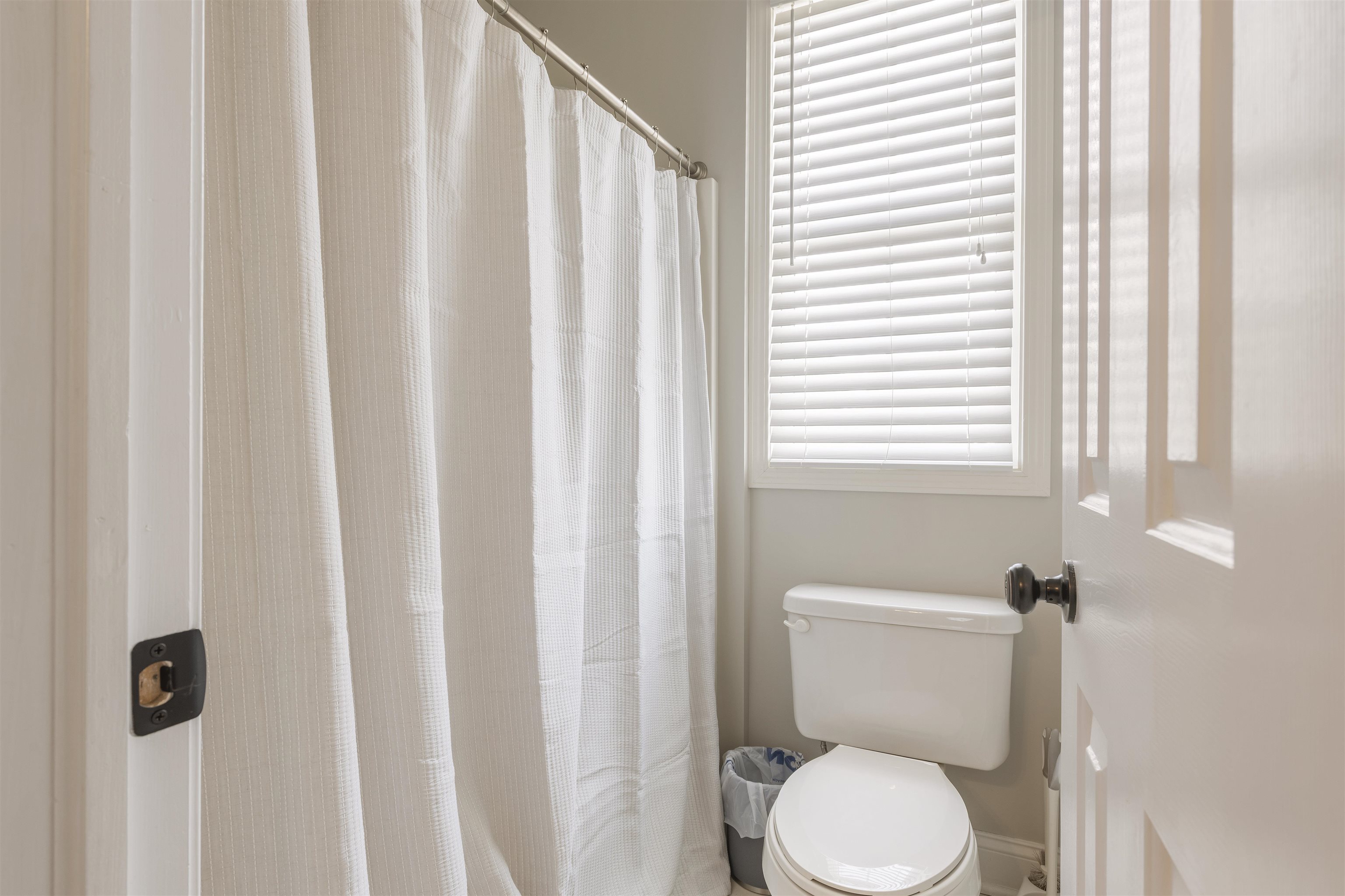 1130 Eagle Chase Drive Seneca, IL 61360 - Photo 35 of 46 a white toilet sitting next to a shower curtain