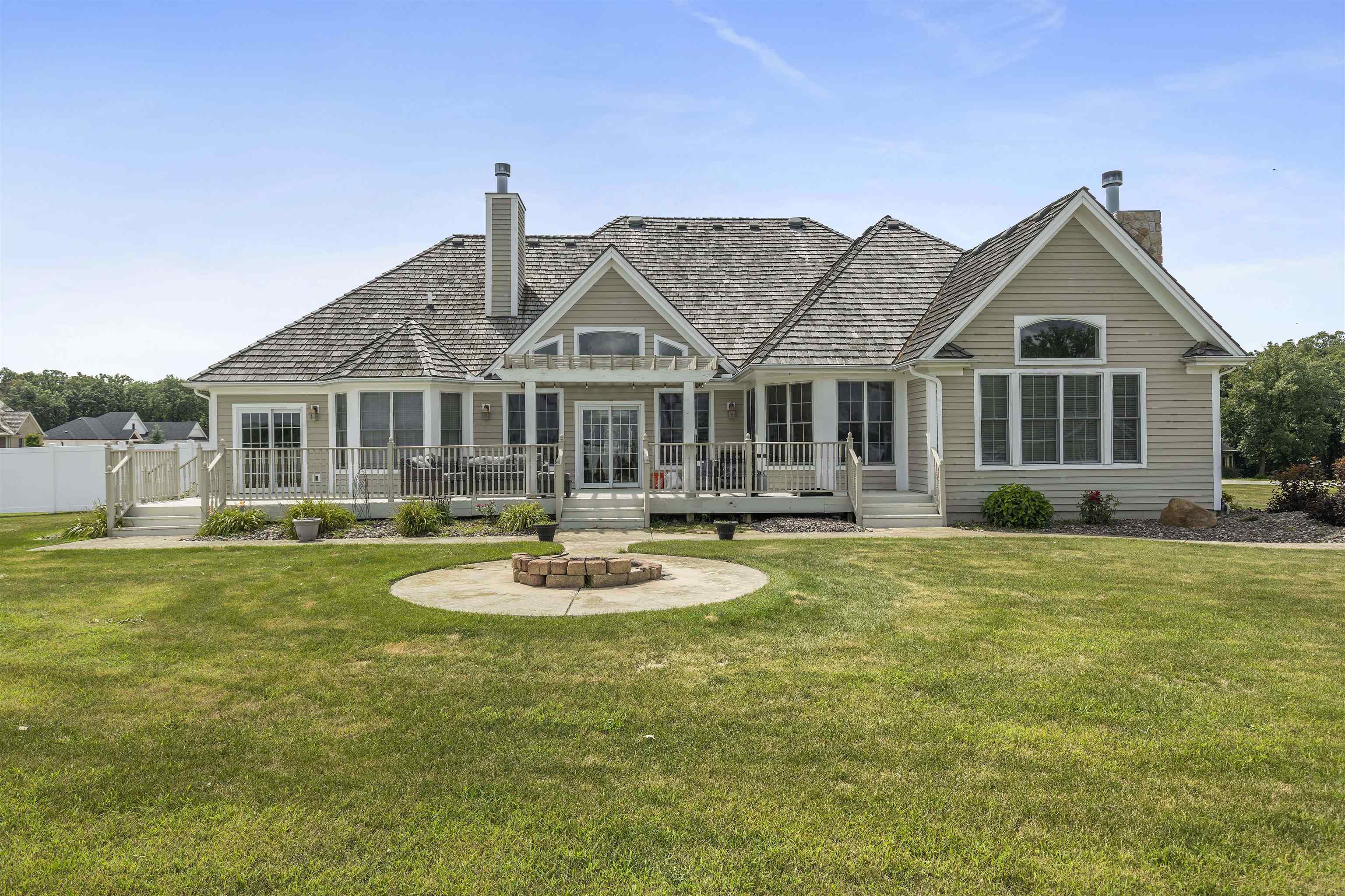 1130 Eagle Chase Drive Seneca, IL 61360 - Photo 7 of 46 a front view of a house with swimming pool having outdoor seating