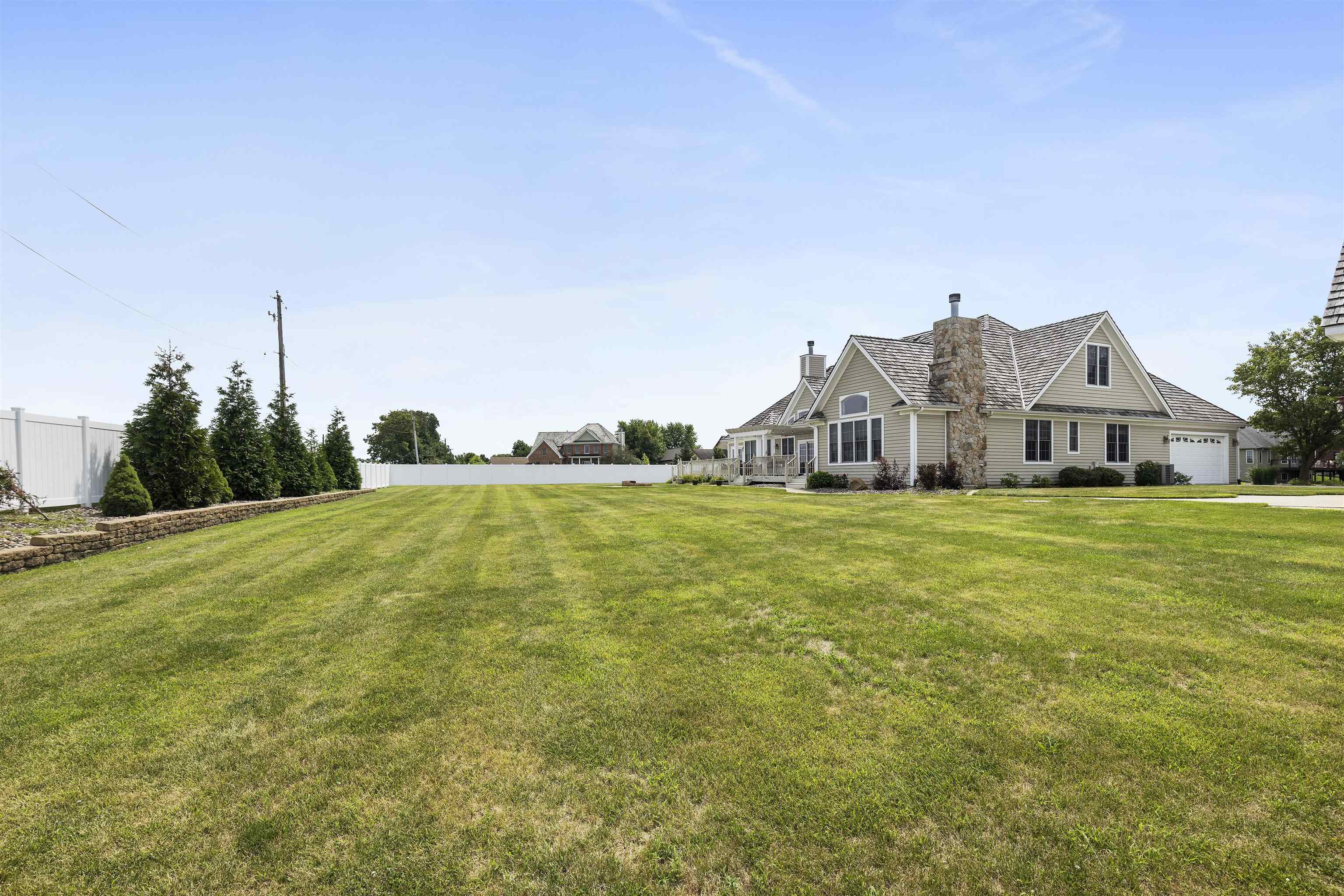1130 Eagle Chase Drive Seneca, IL 61360 - Photo 9 of 46 a house with green field in front of it