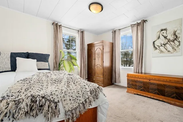 a view of a living room and entryway