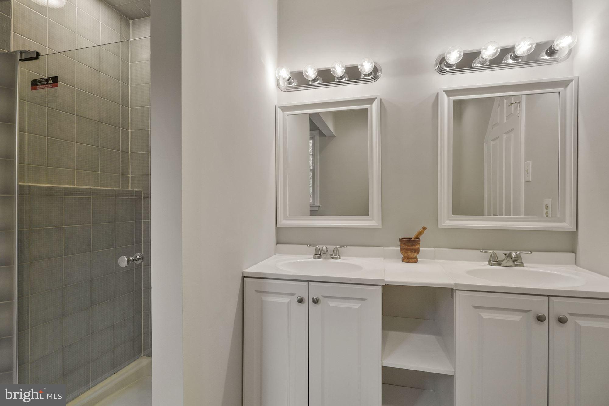 4703 Wards Chapel Road Owings Mills, MD 21117 - Photo 27 of 42 Primary bath w double sinks and tiled shower stall