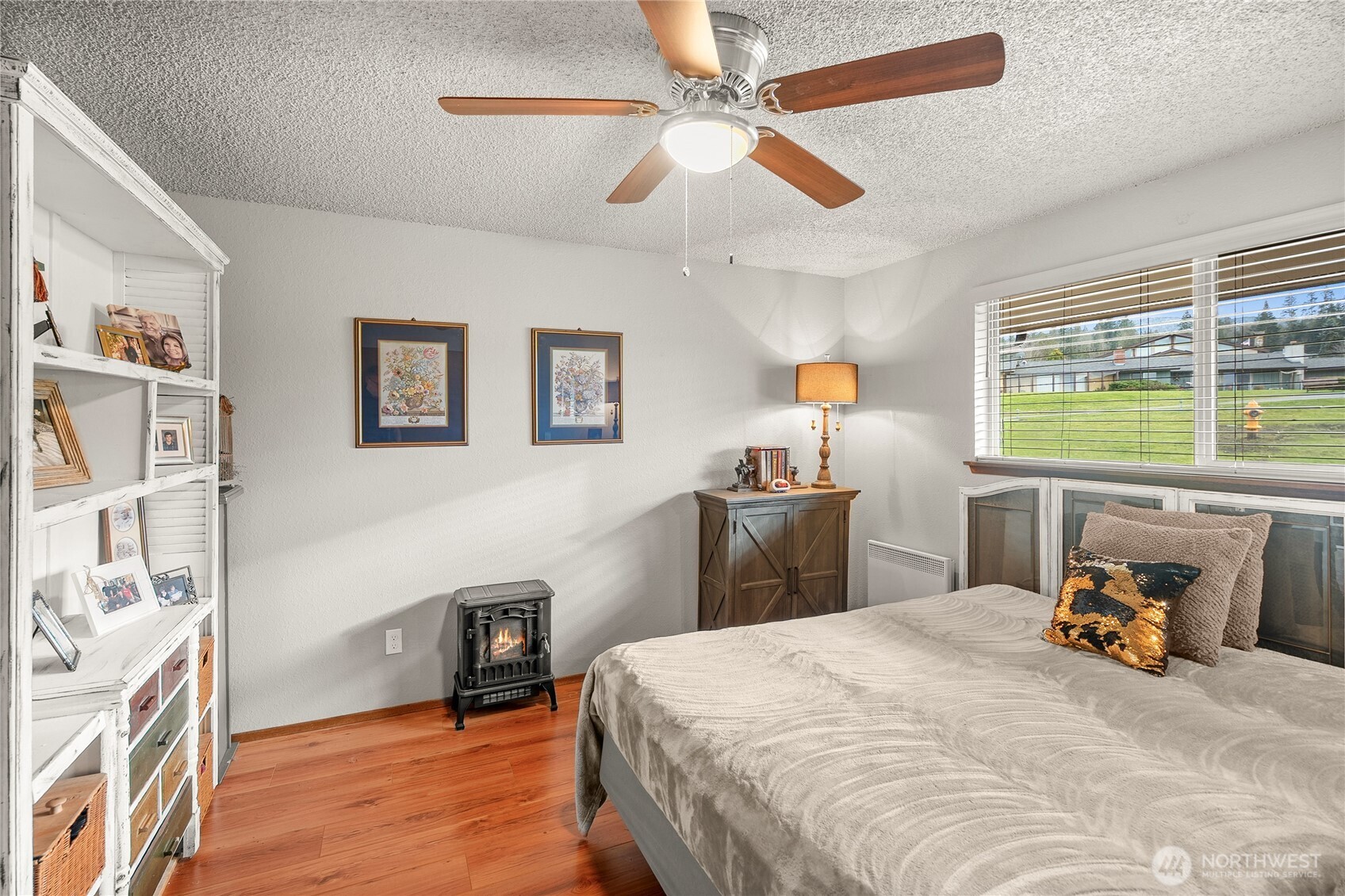 1301 South 3rd Avenue, Unit 15D Sequim, WA 98382 - Photo 11 of 26 a bedroom with a bed dresser and a window