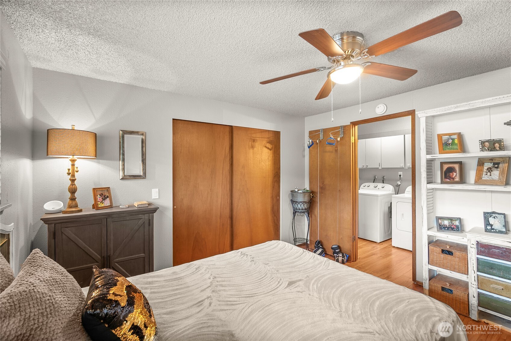 1301 South 3rd Avenue, Unit 15D Sequim, WA 98382 - Photo 12 of 26 a bedroom with a bed and a chandelier