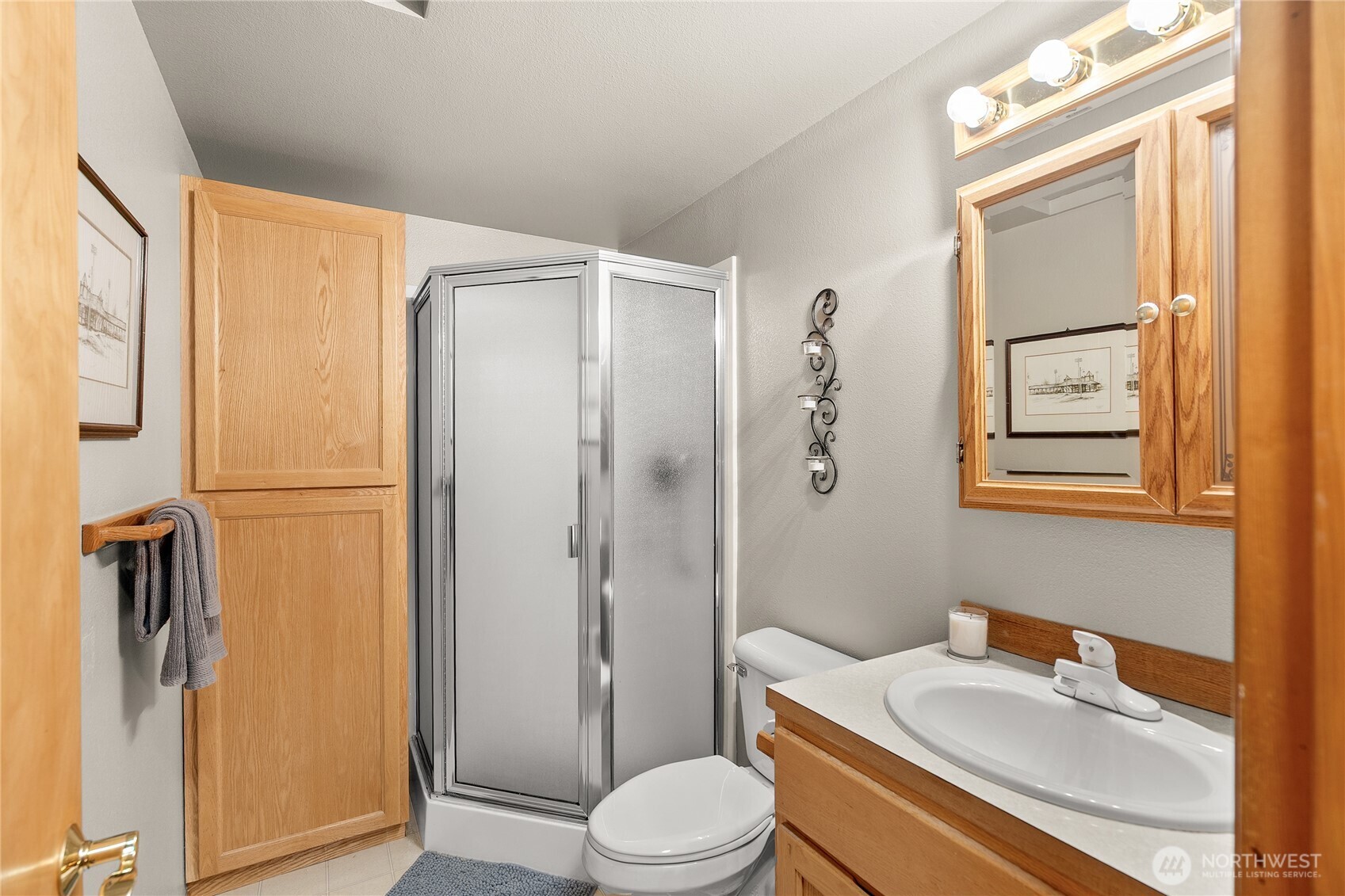 1301 South 3rd Avenue, Unit 15D Sequim, WA 98382 - Photo 17 of 26 a bathroom with a sink toilet and shower